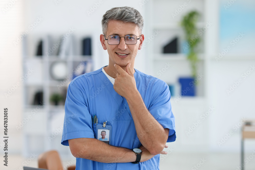Fototapeta premium Portrait of doctor in scrubs at clinic