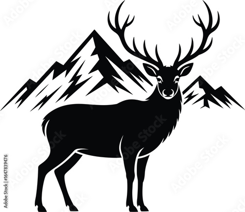 Majestic stag with grand antlers stands before jagged mountains