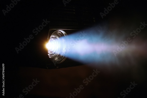 Film projector emitting bright light during home movie showing at night