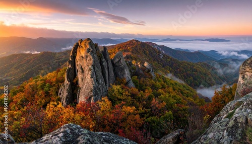 Majestic autumn mountains under sunrise light, panoramic photography of rugged peaks, colorful seasonal tones