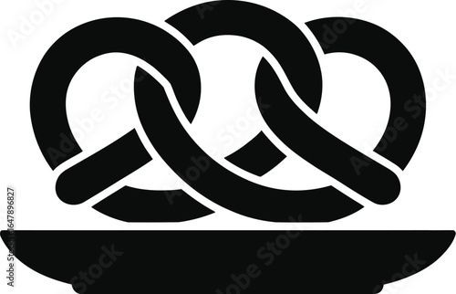 Black pretzel on a white plate baked good dough
