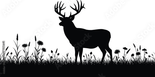 Silhouette of a majestic deer with large antlers standing in wild grass and flowers, perfect for nature, hunting, wildlife design