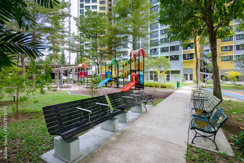 Photography A garden path, rest area, and playground in a green landscape within an HDB estate, Singapore