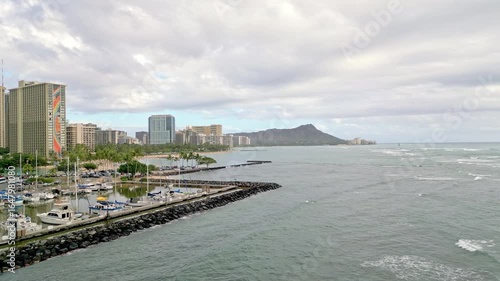 Aerial Drone Footage Showcasing Ala Wai Harbor with the Iconic Honolulu Cityscape and Majestic Diamond Head Crater in the Background