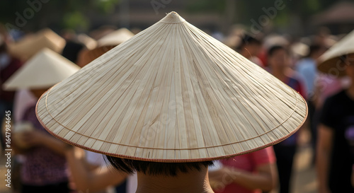A fan wearing a traditional hat from their country.