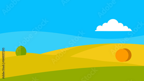 Green grass on a rolling hill with a single tree under a clear blue sky on a bright summer day