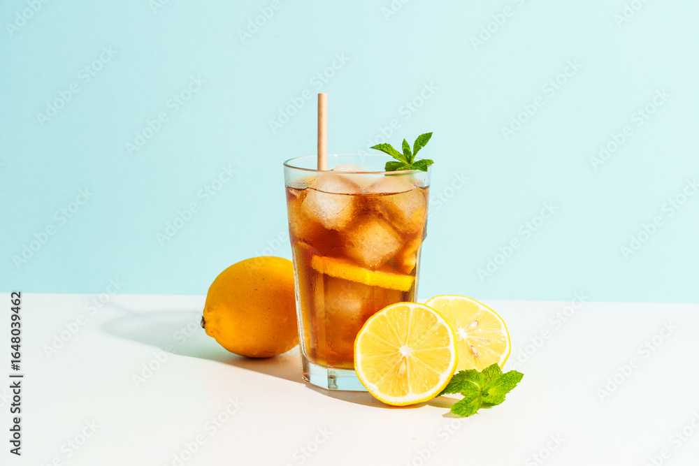 Fototapeta premium Summer cold drink on colored background with hard shadows.
