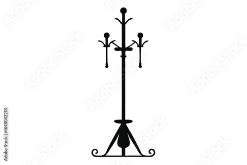 Black Silhouette of a Vintage Metal Coat Rack Stand with Ornate Base