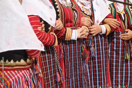 Koprivshtica, Bulgaria - August 10, 2025: People in traditional folk costume of The National Folklore Fair in Koprivshtica
