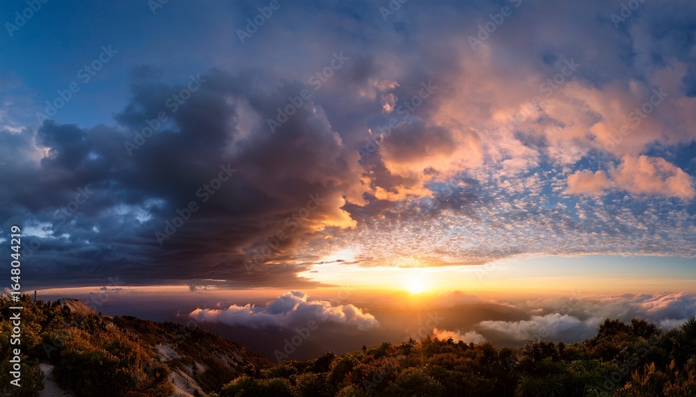 Naklejka premium dramatic sunset sky panorama during golden hour cloud scape serene sky path above raising clouds at sunset