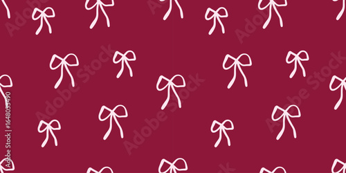 Seamless pattern with pink ribbon bows on a dark pink background
