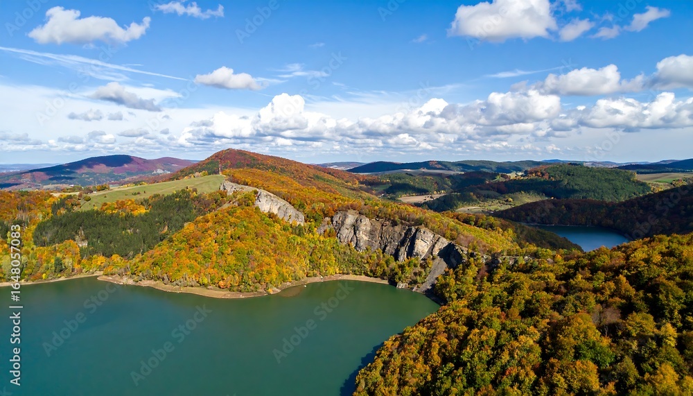 Naklejka premium Autumnal lake nestled in a mountainous landscape