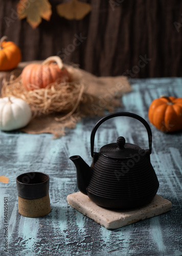 Autumn Pumpkins with black cast iron tea pot and cup