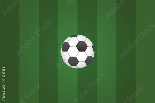 A soccer ball sits centered on a bright green, striped playing field. The ball's iconic black and white pattern is clear, ready for kick-off or practice.