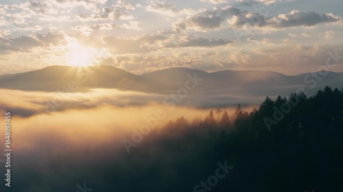 Epic sunrise over foggy Montana mountains aerial perspective