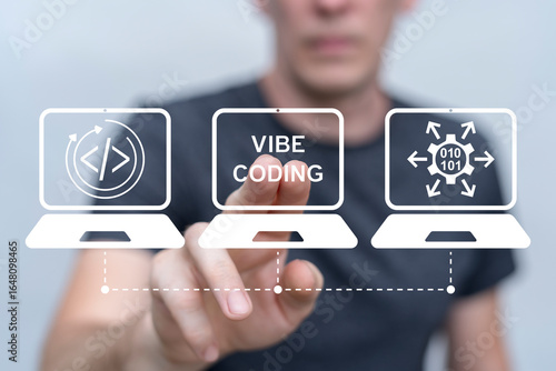 Behang Developer using virtual touch screen presses inscription: VIBE CODING
