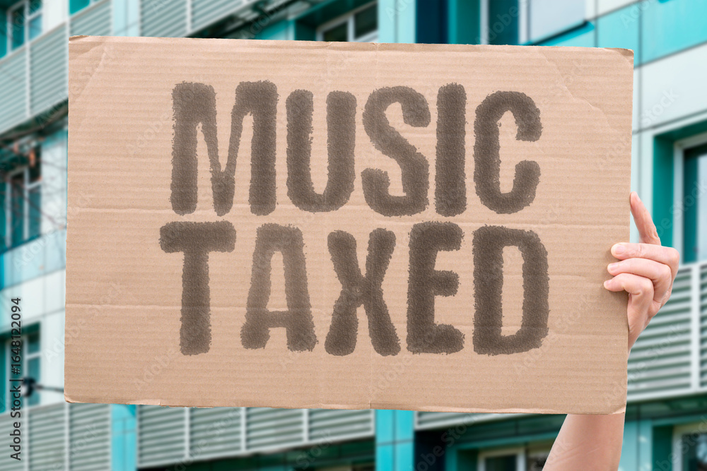 Fototapeta premium “Music taxed” — Why? Melodies require corporate approval. Sonic control. Space Exploitation. CENSORSHIP. ROYALTIES. LICENSING. GATEKEEPING. REGULATION. OWNERSHIP. MONOPOLY