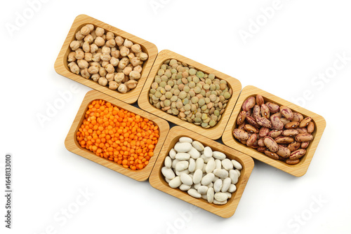 Different type of raw dry legumes composition.  lentils, red lentils, chickpeas and kidney beans. Mix organic legume concept.