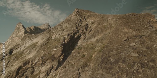 Aerial shot of epic rocky mountain landscape with helicopter blades above