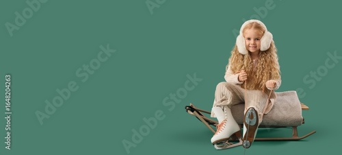 Cute little girl putting on...