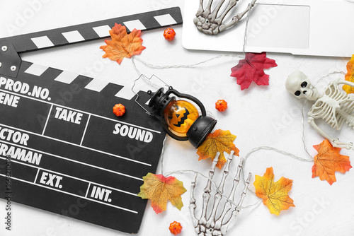 Clapperboard with laptop an...