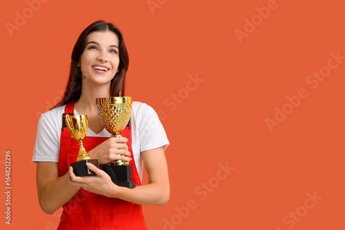 Female worker with gold cup...