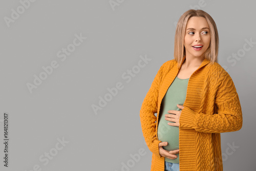 Happy pregnant woman on lig...