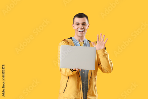 Young man with laptop video...