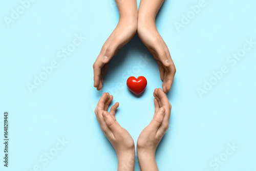 Hands of woman and child wi...