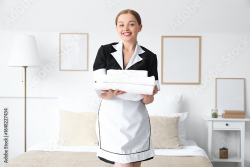 Pretty chambermaid with sta...