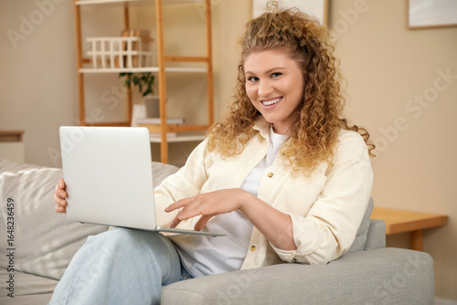 Beautiful young woman worki...
