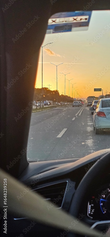 Fototapeta premium Inside a car, sunset, traffec, lights at Tulum, mexico
