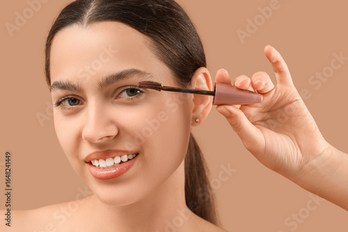 Pretty young woman applying...