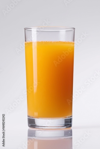 High-resolution image of a glass of fresh orange juice, isolated on a light background, showcasing vibrant color and refreshing texture