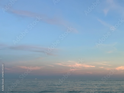 Soft Pastel Sky Over Calm Sea at Dusk