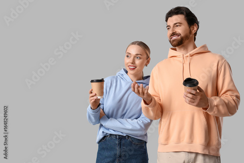 Young couple with coffee cu...