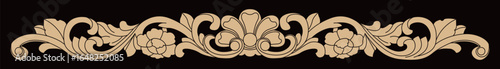 This ornate carved wooden border displays decorative floral and scroll patterns.