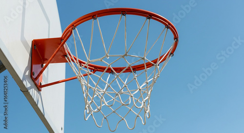 Outdoor basketball hoop with rim and net on a court backboard, a sport game goal to score.