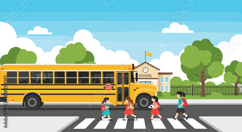 Children happily crossing the street safely in front of a school bus with the school building in the background on a sunny day