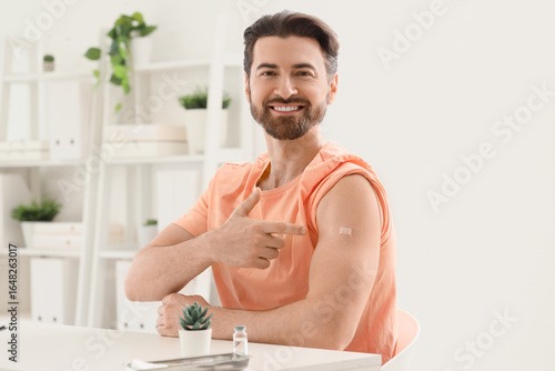 Young man pointing at appli...