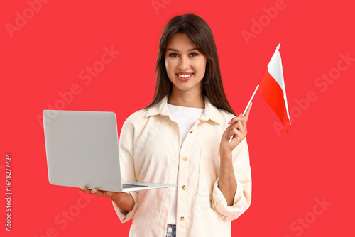 Young woman with laptop and...