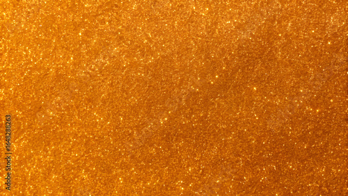 Close-Up of Sparkling Gold Glitter Texture Background  
