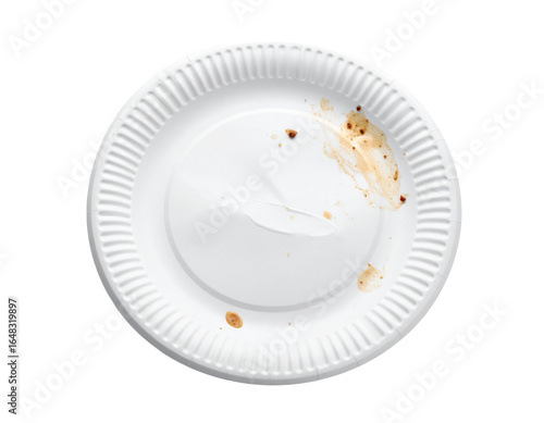 A used and dirty paper plate with food remnants, isolated on a white background, representing food waste and single-use disposable items.