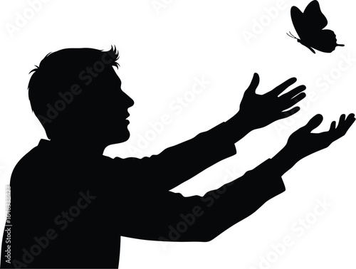 A man releasing a butterfly, silhouette man is opening his hands to let butterfly fly away, symbolizing freedom and hope