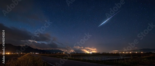 Night sky spectacle over rural landscape