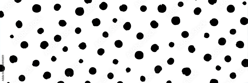 Abstract pattern of scattered black circles on a white background