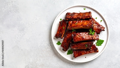 Delicious Sticky BBQ Ribs Stacked on a White Plate, Mouthwatering Ribs Ready to be Served on a Platter