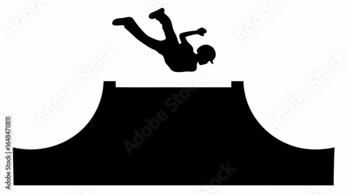 Silhouette of a person performing a trick on a ramp with a helmet and protective gear in black and white