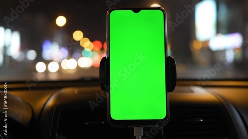 Dynamic In-Car POV of a Smartphone with Green Screen for Navigation During a Night City Drive.