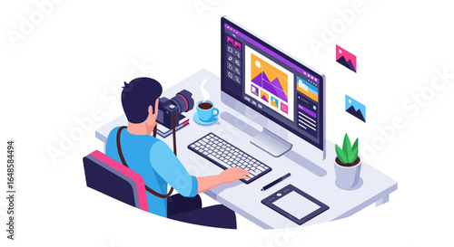 Graphic designer working on computer with camera and tablet